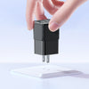 one hand holding black charger